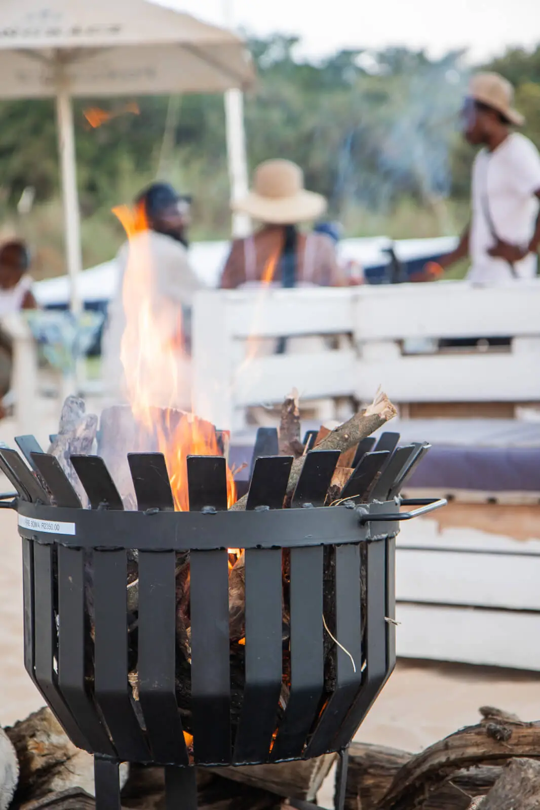 A firepit burning on the beach